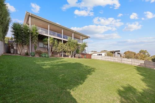 a large yard in front of a house at Saltwater Breeze Retreat in Cowes