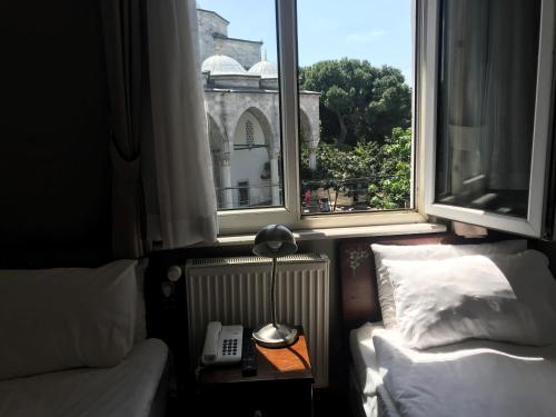 Postel nebo postele na pokoji v ubytování No20 Hotel Sultanahmet