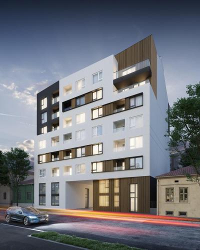a building with a car parked in front of it at Lux apartment 8, center, free parking in Niš
