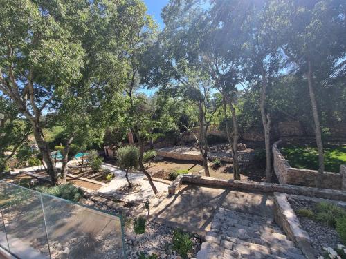 an overhead view of a garden with trees at Villa THAÏS in Nîmes
