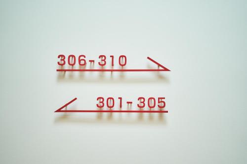 a pair of numbers on a white background at Rakuten STAY Osaka Station North in Osaka