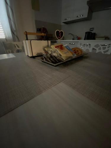 a tray of food sitting on the floor in a living room at B&B al Vicoletto in Bellante