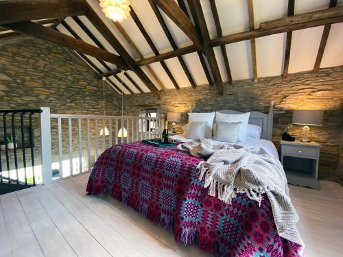 Ένα ή περισσότερα κρεβάτια σε δωμάτιο στο Granary Cottage St Clears