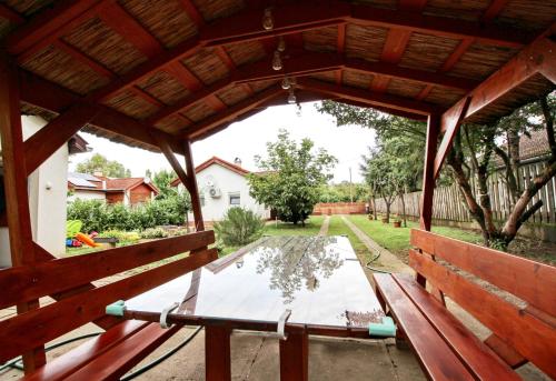 a view from the inside of a pavilion with a table at Levendula Apartman Berekfürdő in Berekfürdő