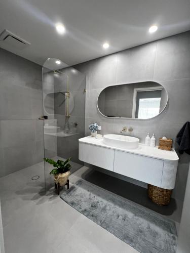 a bathroom with a sink and a mirror at Retreat on Fig Street in Dromana