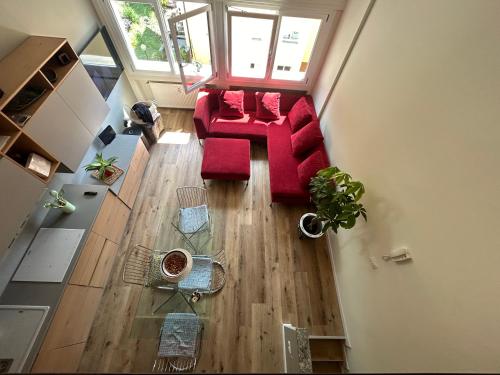 an overhead view of a living room with a red couch at Varenna Guest House in Varenna