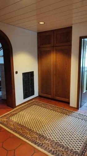 a room with a door and a mat on the floor at Landhaus Anne in Obermaiselstein
