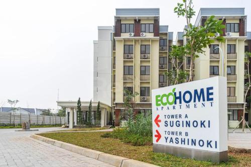 a welcome sign in front of a building at RedLiving Apartemen Eco Home - Wieg's Room Tower B Yashinoki in Tangerang