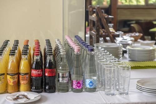 a group of bottles and glasses on a table at Patak Park Hotel Visegrád in Visegrád