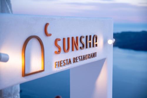 a sign that reads sunsie fiesta restaurant at CASA SUNSHA SANTORINI in Fira