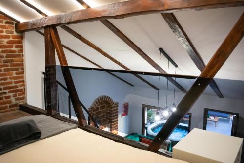 a room with a large window with beams at Golden Pinpoint in Gornje Vratno