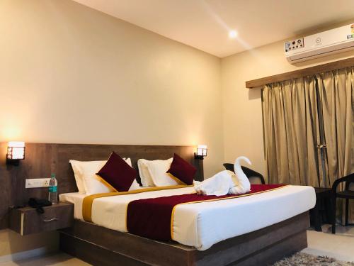 Vuode tai vuoteita majoituspaikassa Hotel Rameswaram KNP Nest