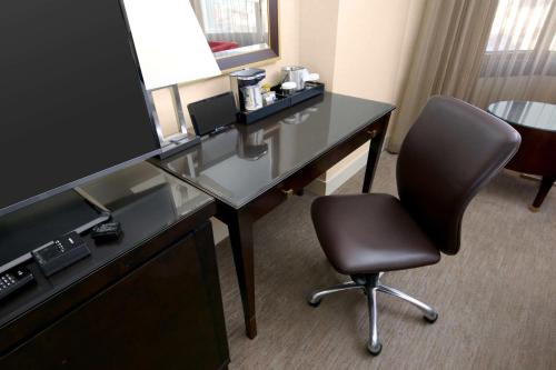 a desk with a chair in a hotel room at Hilton Parc 55 San Francisco Union Square in San Francisco