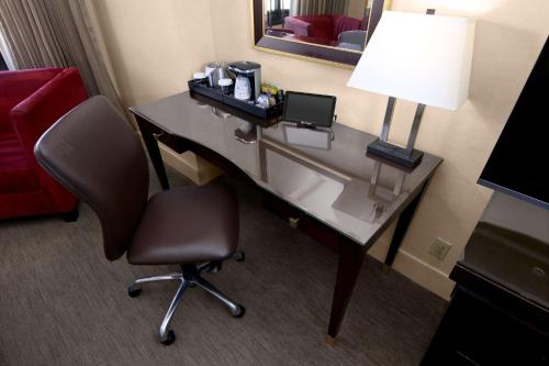 a desk with a lamp and a chair in a hotel room at Hilton Parc 55 San Francisco Union Square in San Francisco