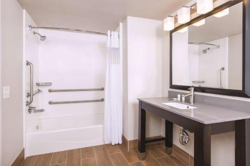 a bathroom with a sink and a shower at La Quinta by Wyndham Fairfield - Napa Valley in Fairfield