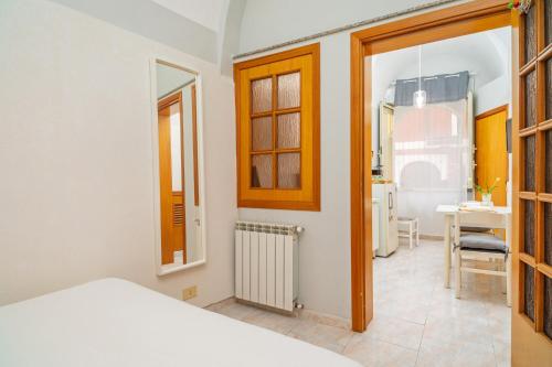 Ένα ή περισσότερα κρεβάτια σε δωμάτιο στο Casa Idda