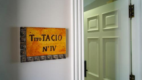 a sign that says two tacoma ny on a door at Apartamentos Puente Romano Suites Parking Gratis in Merida