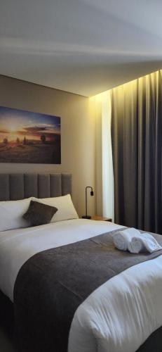 Katil atau katil-katil dalam bilik di Oryx Boutique Hotel