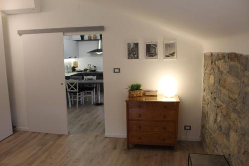 a living room with a dresser and a dining room at The way to trieste bikes storage in Trieste