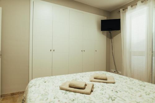 En eller flere senge i et værelse på Vista Marina-Los Gigantes