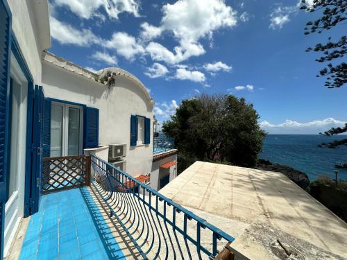 a balcony of a house with a view of the ocean at Rada Azzurra in Amalfi
