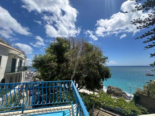 a view of the ocean from a balcony of a building at Rada Azzurra in Amalfi