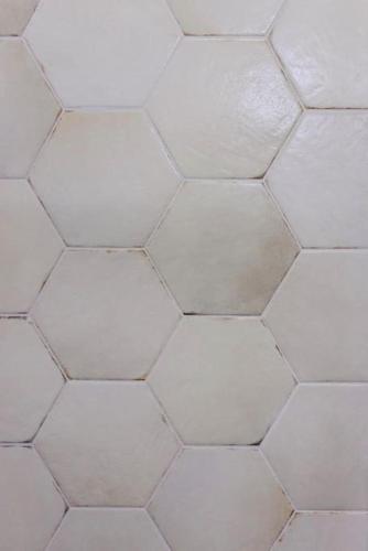a close up of a white tiled floor at Studio K2 in Brno
