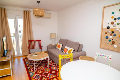 a living room with a couch and a table at TURISALENTEJO - ATIVIDADES TURÍSTICAS, LDA in Redondo