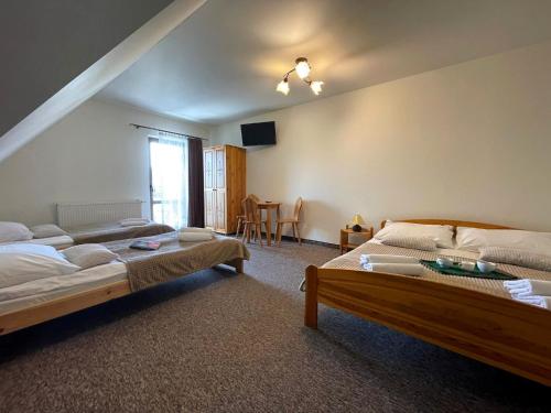 Ένα ή περισσότερα κρεβάτια σε δωμάτιο στο Skalny Brzeg