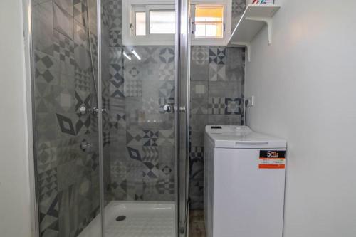 a bathroom with a shower and a sink at Sol y mar maspalomas in Maspalomas