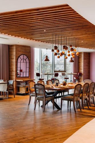 a dining room with a table and chairs at Concorde Tower Hotel & Casino in North Nicosia