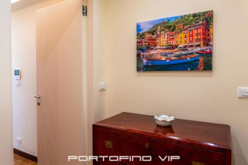 a room with a painting on the wall at Paraggi Apartment by PortofinoVip in Paraggi