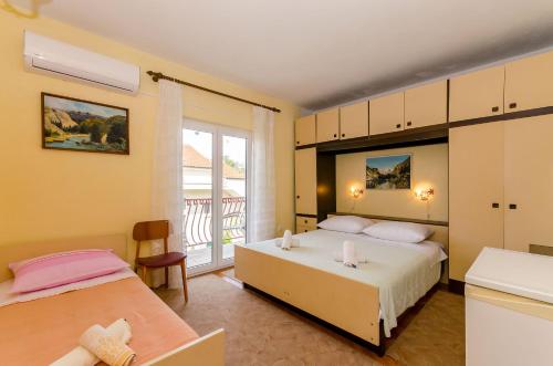 Posteľ alebo postele v izbe v ubytovaní Rooms Ante