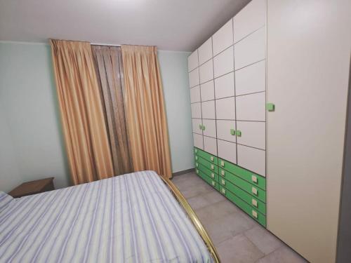 a bedroom with a bed and a shower at Matis Appartamenti in Camisano