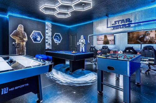 two tables in a game room with star wars memorabilia at 5BR Family Home with Pool & Hot Tub Near Disney in Kissimmee