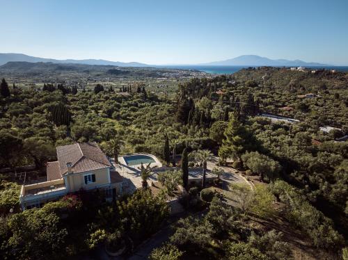 an aerial view of a house with trees and the ocean at Almeira 4acre Estate, for Unparalleled Seclusion, By ThinkVilla in Zakynthos