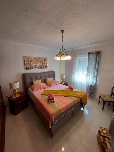 a bedroom with a large bed in a room at Apartments Tatjana in Senj