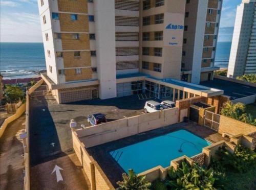 an overhead view of a hotel with a swimming pool at High Tide Beach Condo in Durban