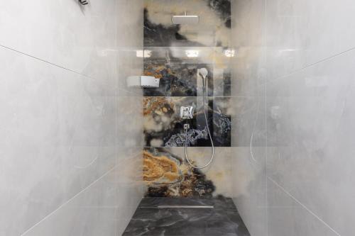 a bathroom with a shower with smoke coming out of it at Apartment Island Krk Queen 1 in Krk