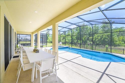 Upstay 9BR Disney Retreat w Pool, BBQ & Hot Tub photo 9