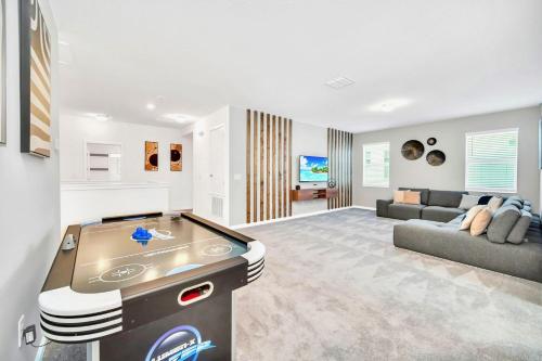 a large living room with a pool table in it at 10BR Resort Home - Pool Hot tub Games - Near Disney in Kissimmee