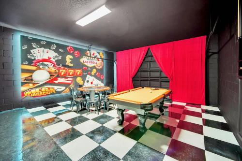 a ping pong room with a ping pong table at 10BR Resort Home - Pool Hot tub Games - Near Disney in Kissimmee