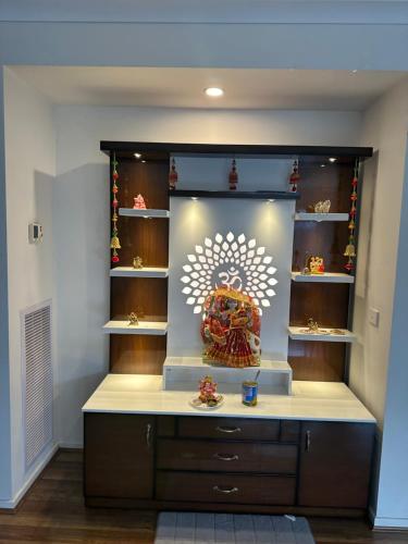 a display case in a room with a shelf at Home away from home private room2 in Truganina