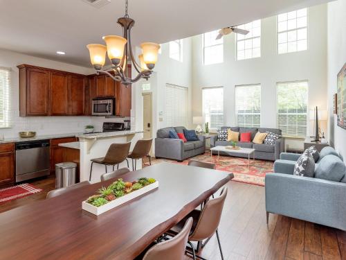 a kitchen and living room with a table and chairs at East Austin Family Home - 5 mins from downtown in Austin