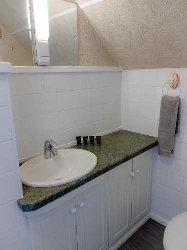 a bathroom with a sink and a mirror at Home and Away near the Spa in Bridlington