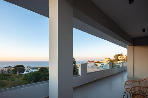 a view of the ocean from the balcony of a house at Rousso Villa in Roussospítion