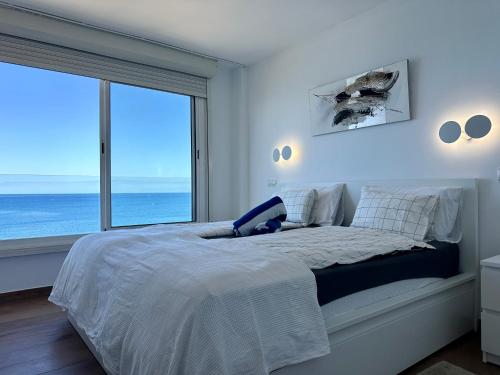 Postel nebo postele na pokoji v ubytování 2 SCHLAFZIMMER FERIENWOHNUNG DiREKT AM STRAND