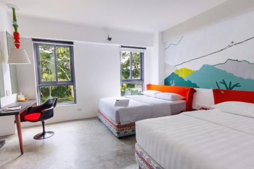 Postel nebo postele na pokoji v ubytování Canvas Boutique Hotel