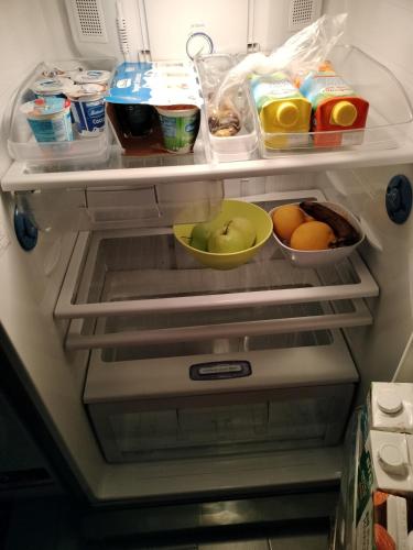 an open refrigerator filled with lots of food at La Terrazza della Nonna in Palermo