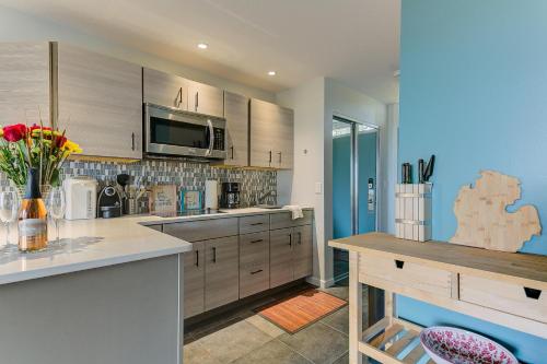 a kitchen with wooden cabinets and a counter top at The Shores in Williamsburg